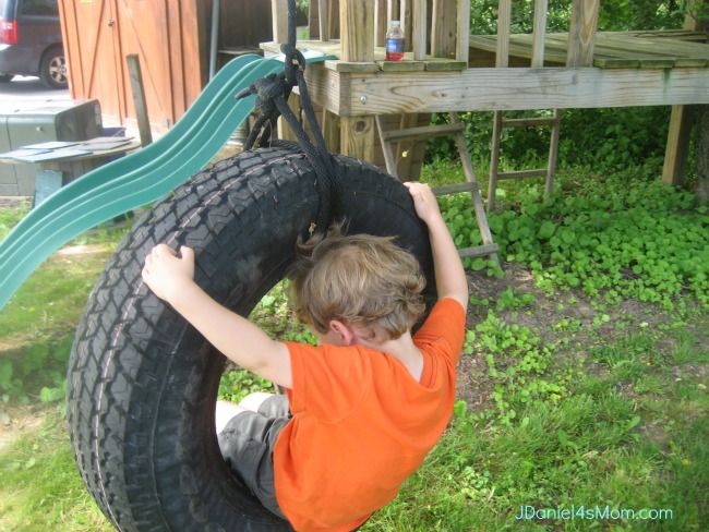 Capturing Memories- Our Time in New York with Family. Riding a tire swing.