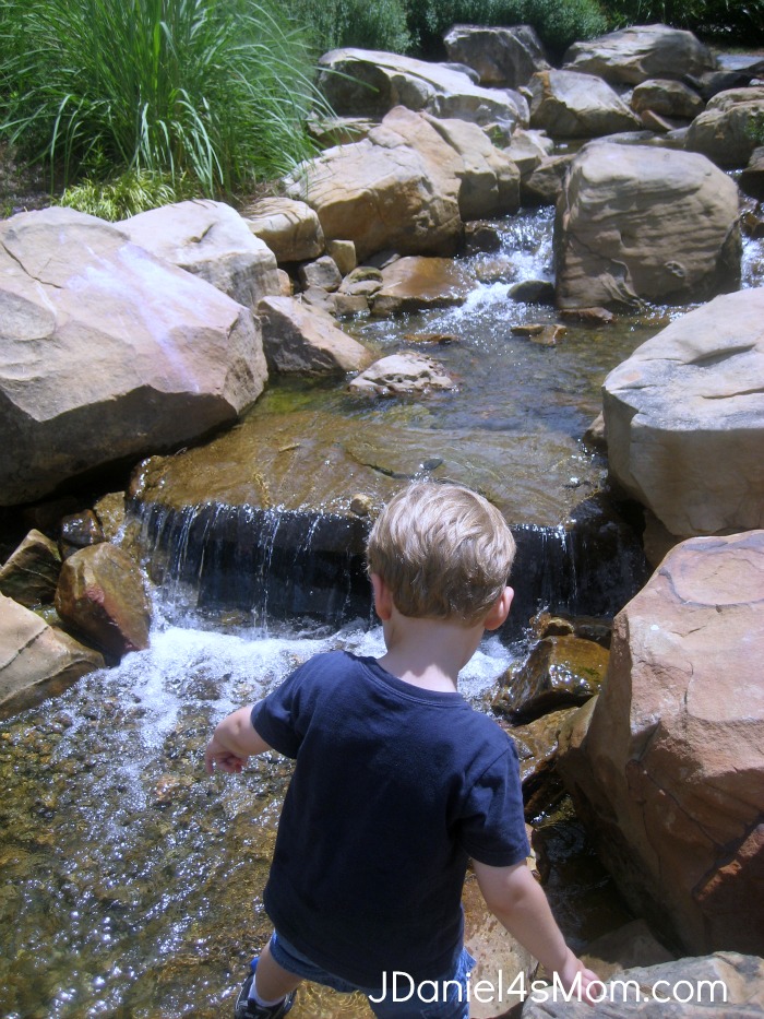 Exploring the falls at Legacy Park.