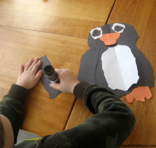 Penguin Craft - Torn Paper Penguin : Putting the penguin's wings together.