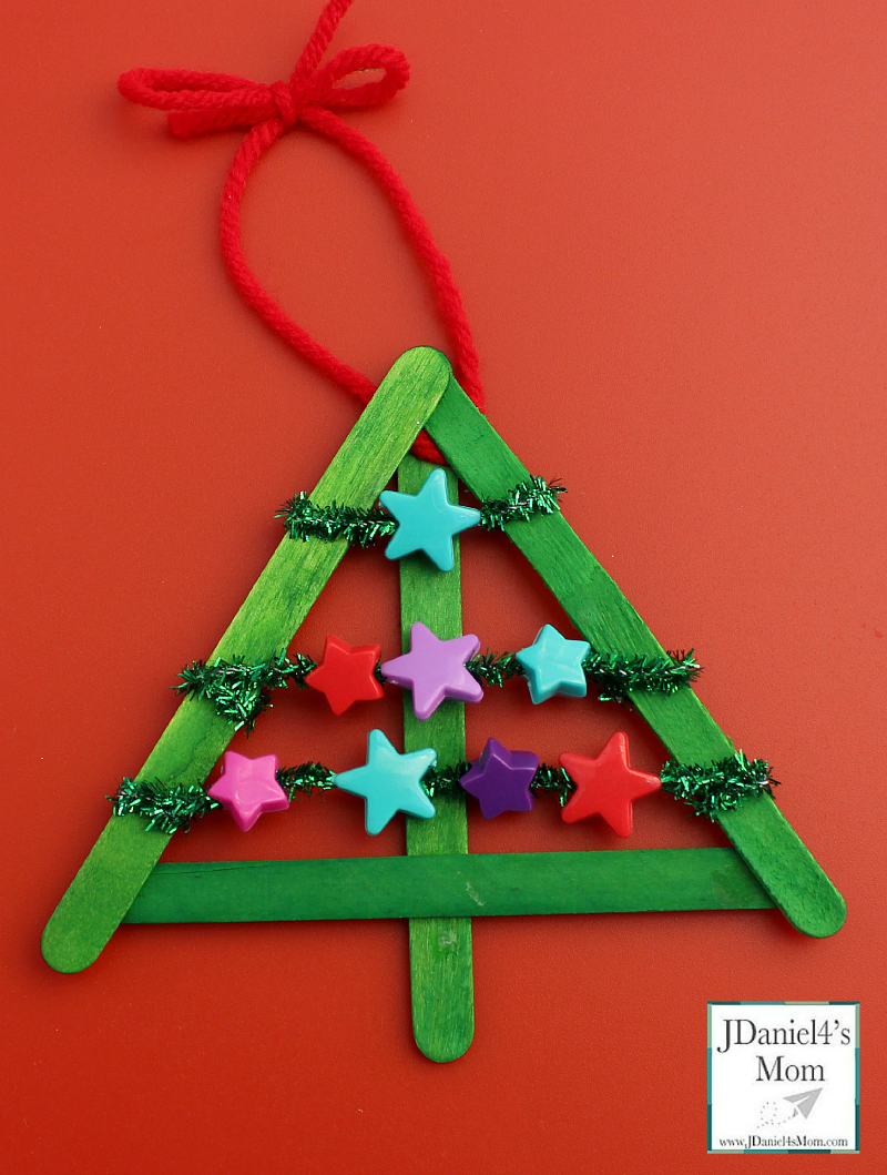 DIY Christmas Decorations Threaded Star Tree- Kids will get to work on their fine motor skills while creating this keepsake Christmas ornament. 