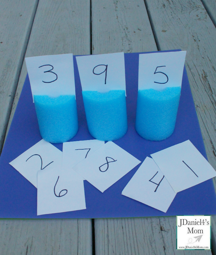 Place Value Games Played with Pool Noodle Place Cards - These games focus on building one, two and three digit numbers.