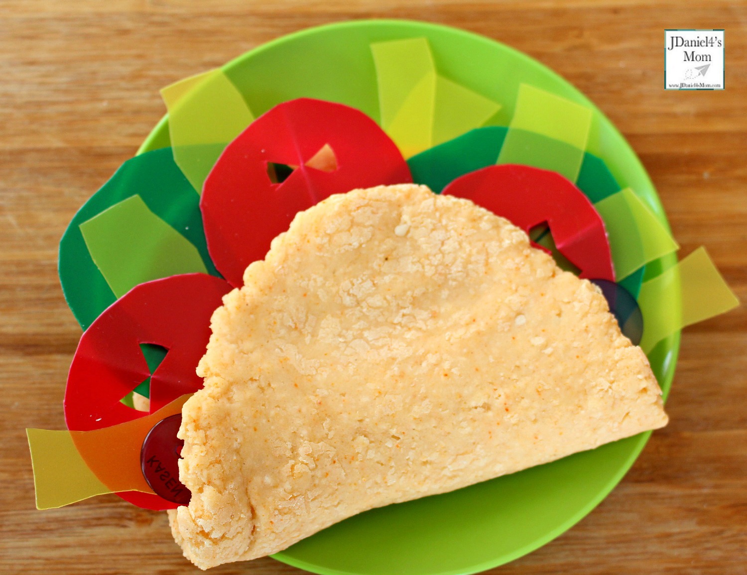 Dragons Love Tacos Themed Playdough Recipe and Activity - Children at home and students at school will have fun building dinosaurs sized tacos with taco scented playdough. This playdough recipe is so easy to make. This what a finished taco looks like.