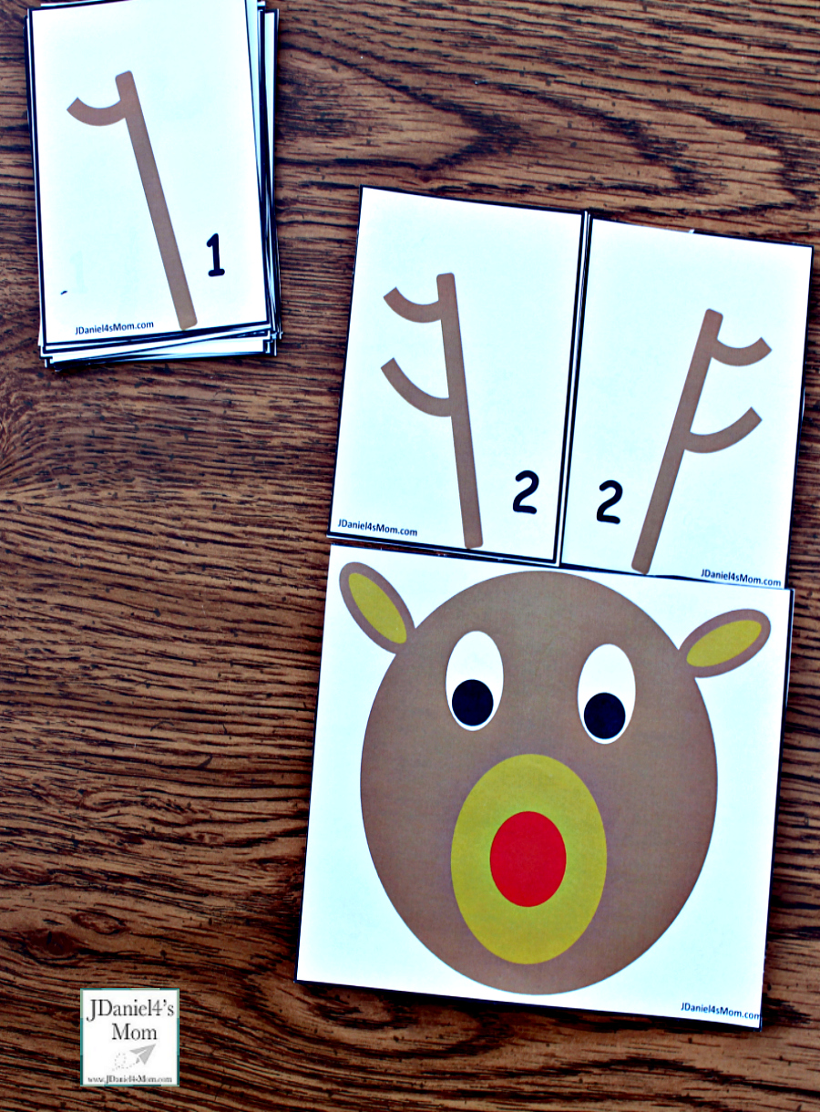 Reindeer Antlers Number Recongition - Students at school or children at home can work on number recognition and counting skills using this free printable set. It includes reindeer counting heads and ten pairs of antlers. Each anter card displays a number in antler points and number form. Children will have fun changing the number o antlers on their reindeer. This pair explores the number 2.