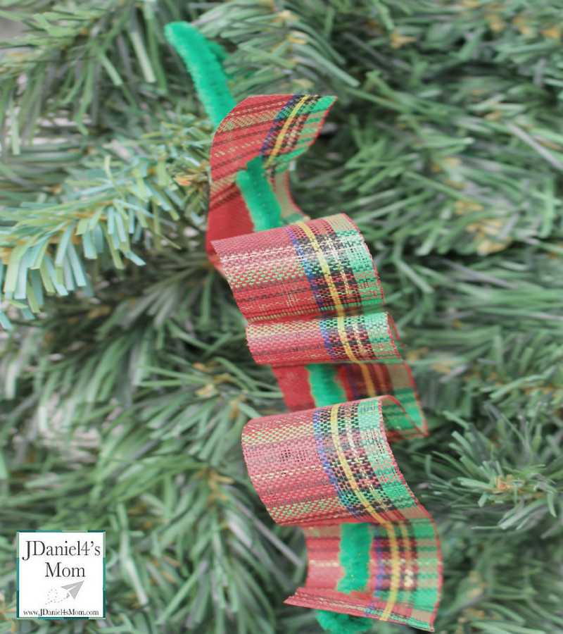 Ribbon Candy Homemade Ornament- Fun fine motor craft for kids. They will have fun weaving pretty holiday ribbons through pipe cleaners.