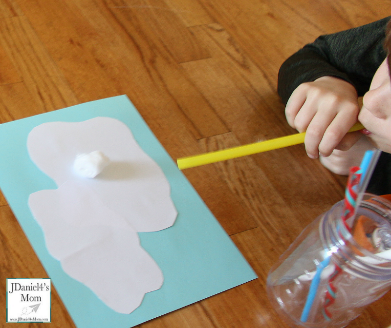 Sensory Activity- Blowing Clouds with a Straw: Blowing a cotton ball from cloud to cloud.