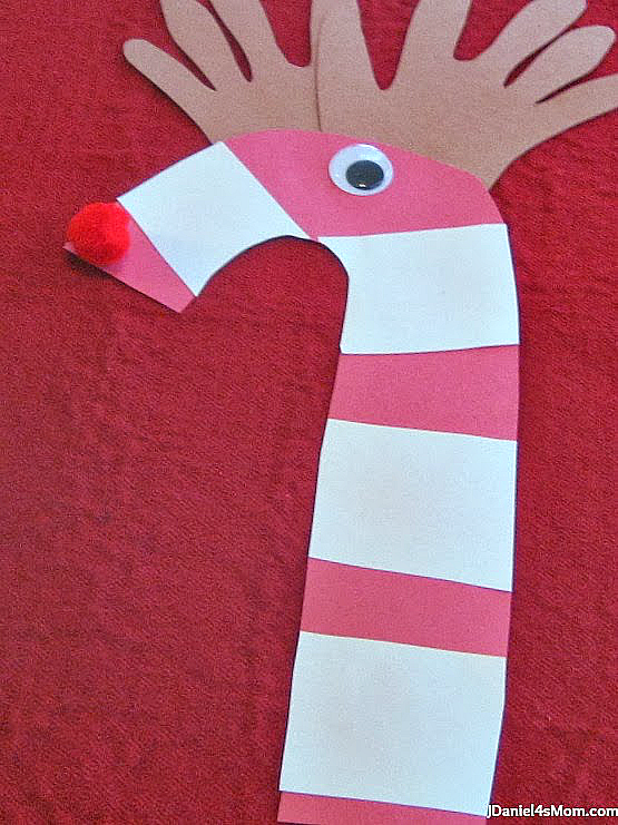 Christmas Craft- Candy Can Reindeer: Kids will love having their hands become reindeer antlers.