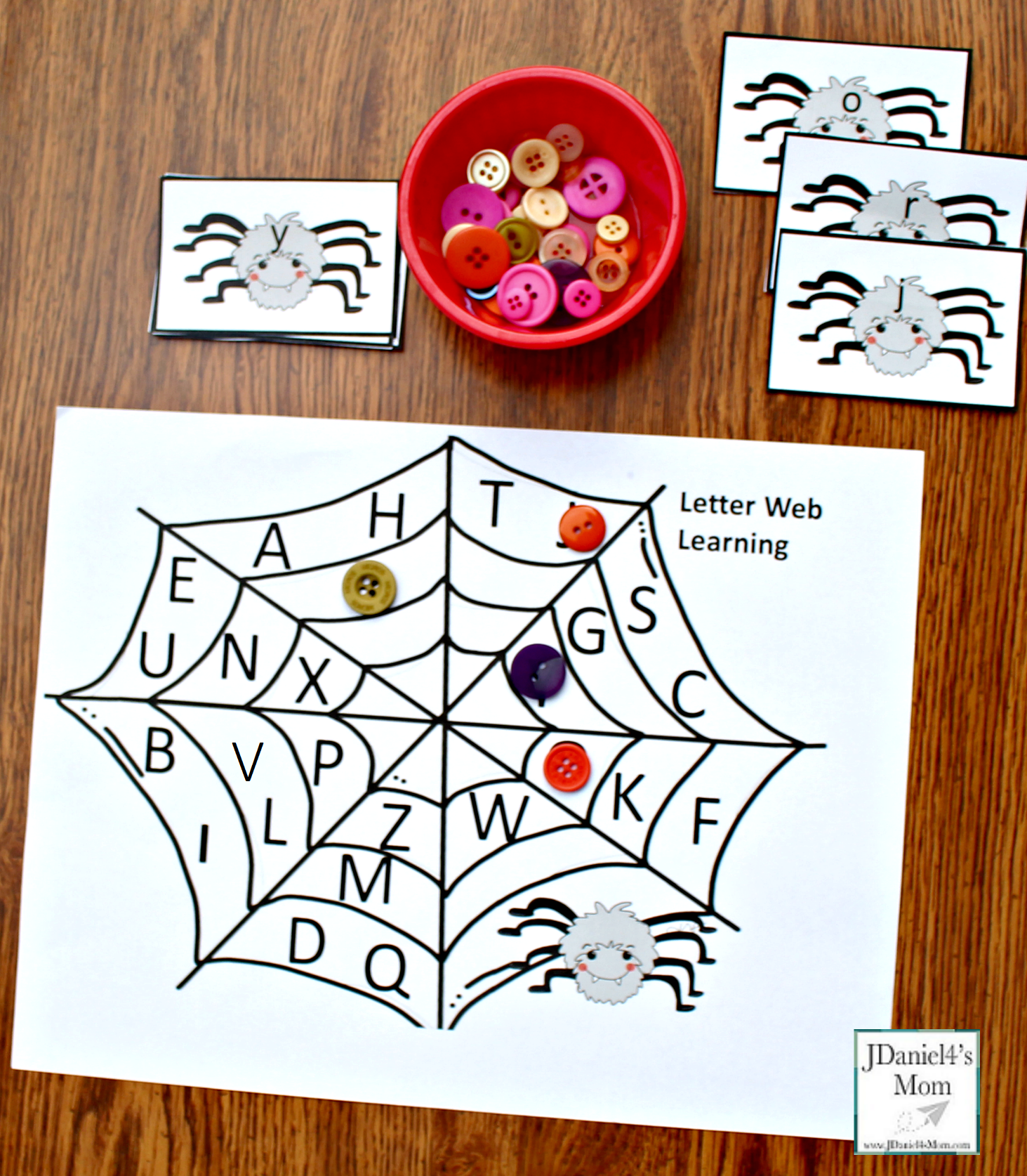 Alphabet Match Game with a Spider Theme - This is a free printable set includes spider letter cards and letter web.