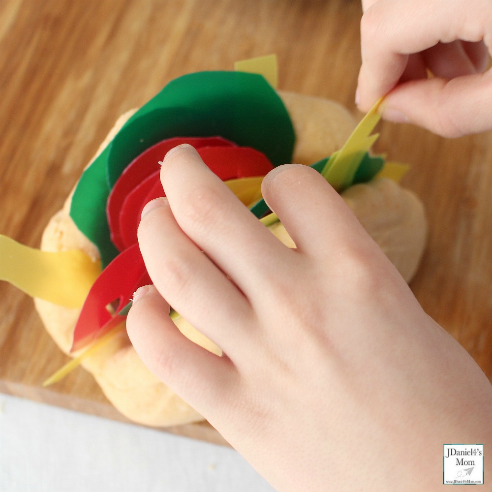 Dragons Love Tacos Themed Playdough Recipe and Activity - Children at home and students at school will have fun building dinosaurs sized tacos with taco scented playdough. This playdough recipe is so easy to make. Building a standing taco.