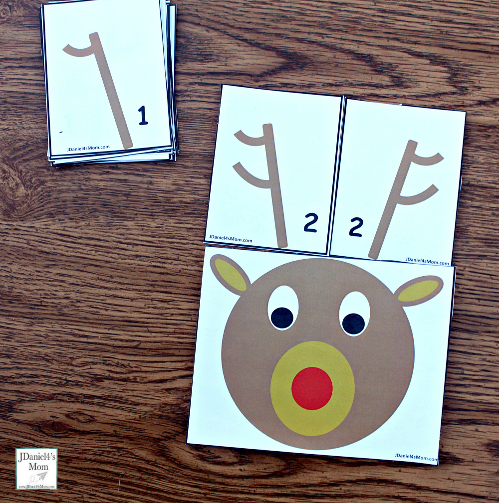 Reindeer Antlers Number Recongition - Students at school or children at home can work on number recognition and counting skills using this free printable set. It includes reindeer counting heads and ten pairs of antlers. Each anter card displays a number in antler points and number form. Children will have fun changing the number o antlers on their reindeer. This pair explores the number two.